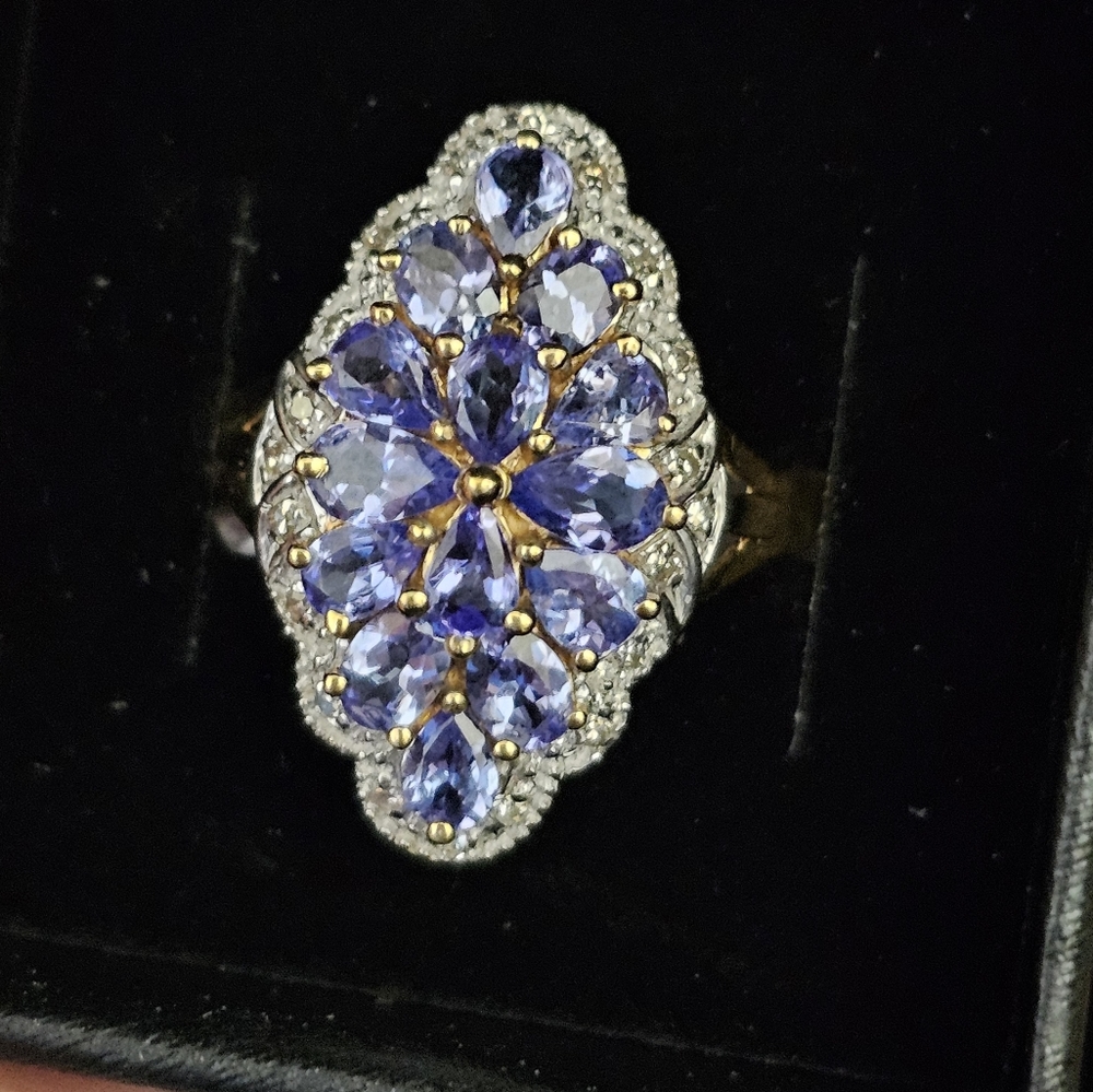 New. 10k tanzanite & diamond ring size 7. Can be resized by a jeweler. Stamped 1